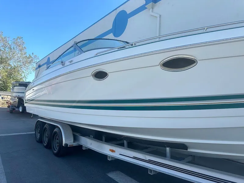 Slide: The Image of 1999 Formula 330 SS boat on a trailer, side view. - 5