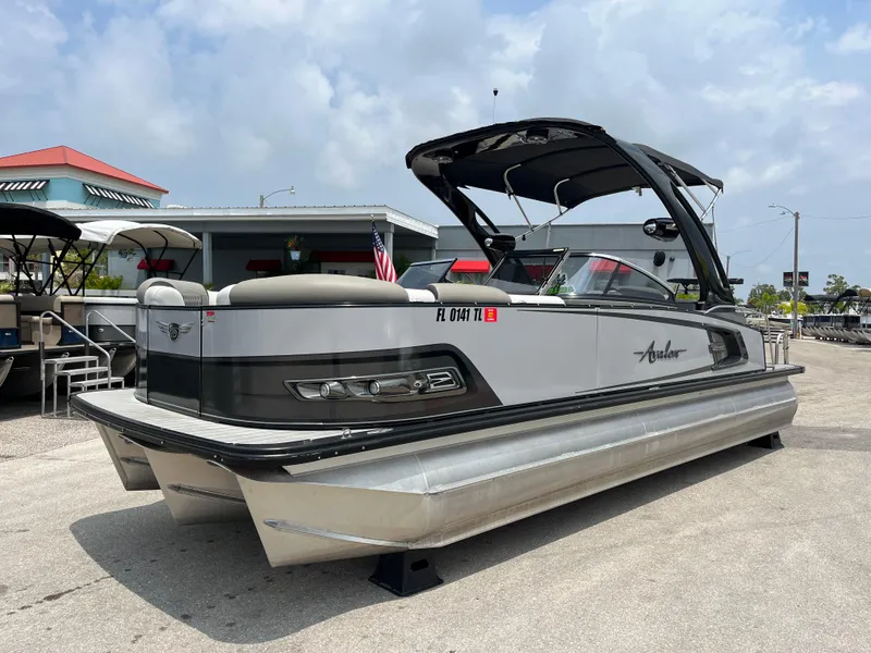 Slide: The Image of 2023 Avalon 2585 Excalibur LTD Tri Toon with Mercury Racing 400R, high-performance pontoon boat. - 0