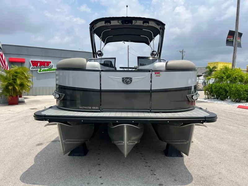 Slide: The Image of 2023 Avalon 2585 Excalibur LTD Tri Toon with Mercury Racing 400R, rear view. - 1