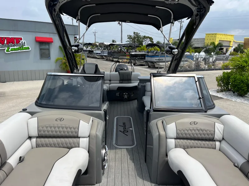 Slide: The Image of 2023 Avalon 2585 Excalibur LTD Tri Toon with Mercury Racing 400R, high-performance boat interior. - 15
