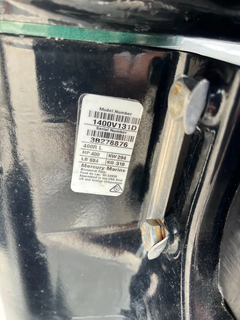 Slide: The Image of Close-up of 2023 Avalon Excalibur LTD Tri Toon Mercury Racing 400R engine label. - 22