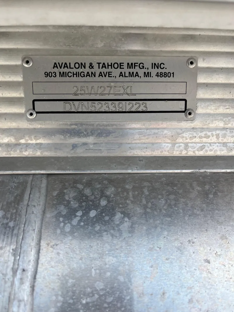 Slide: The Image of Manufacturer plate of 2023 Avalon 2585 Excalibur LTD Tri Toon boat. - 23