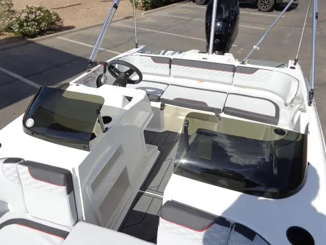 Slide: The Image of 2023 Bayliner Element M17 boat interior with seating and steering console. - 12