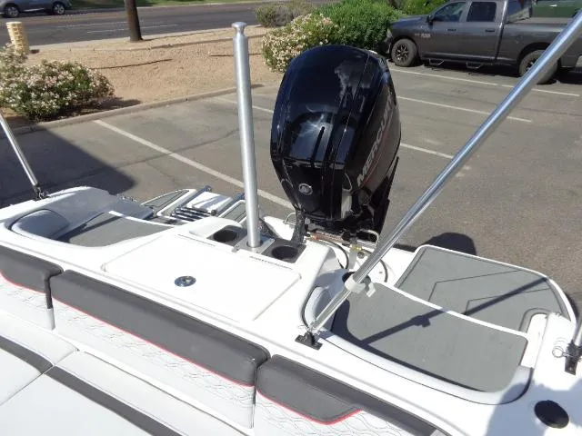Slide: The Image of 2023 Bayliner Element M17 boat with Mercury outboard motor in parking lot. - 13