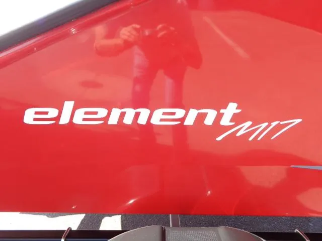 Slide: The Image of 2023 Bayliner Element M17 logo on red boat hull. - 17