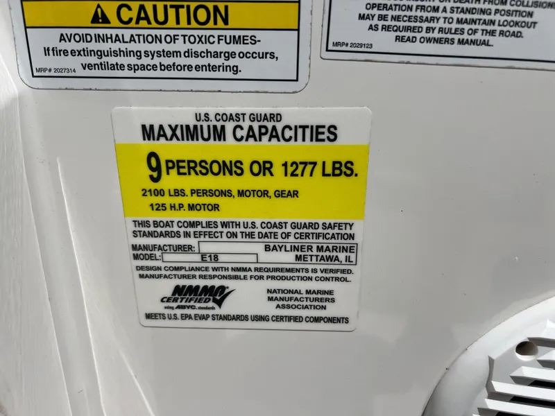 Slide: The Image of 2023 Bayliner Element E18 capacity label, 9 persons or 1277 lbs, 125 HP motor. - 16
