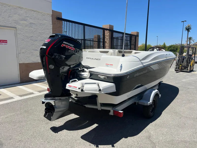 Slide: The Image of 2023 Bayliner Element E18 boat with outboard motor on trailer. - 3