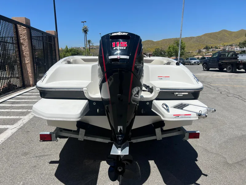 Slide: The Image of 2023 Bayliner Element E18 boat with Mercury 115 outboard motor, rear view. - 4