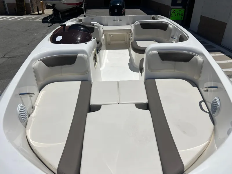 Slide: The Image of 2023 Bayliner Element E18 boat interior with spacious seating and modern design. - 6