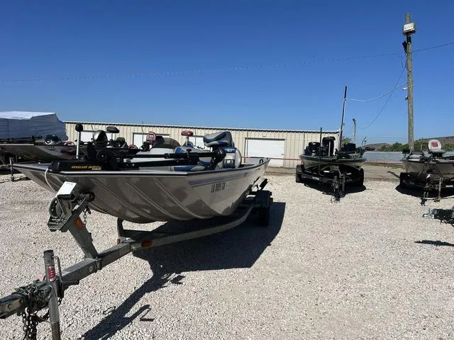 Slide: The Image of 2009 G3 Eagle 176 boat on a trailer in a gravel lot. - 4