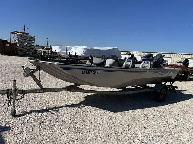 Slide: The Image of 2009 G3 Eagle 176 boat on a trailer in a gravel lot. - 5