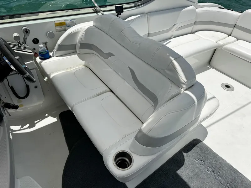 Slide: The Image of Interior of a 2005 Formula 370 Super Sport boat with white seating. - 10