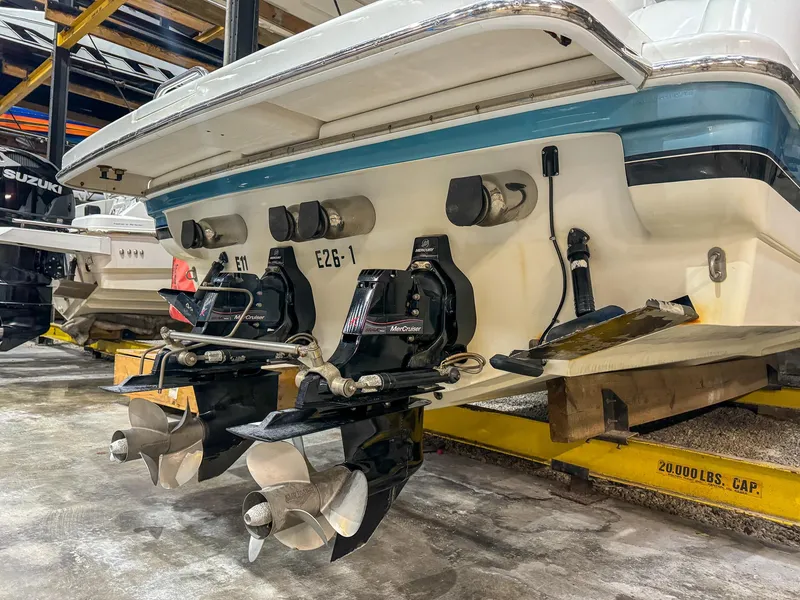 Slide: The Image of Rear view of a 2005 Formula 370 Super Sport boat in storage. - 20