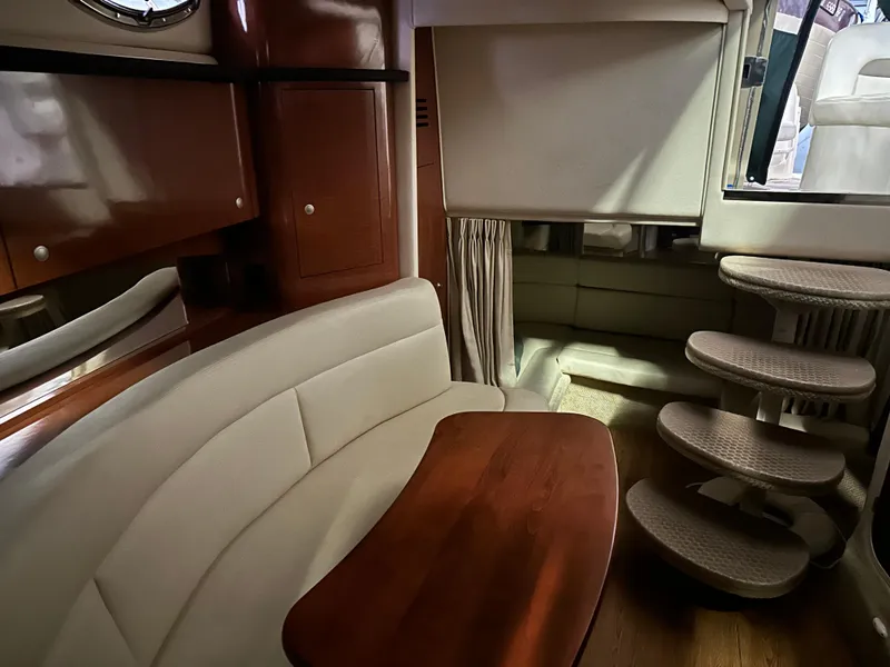 Slide: The Image of Interior of 2005 Sea Ray 320 Sundancer with seating area and stairs. - 7