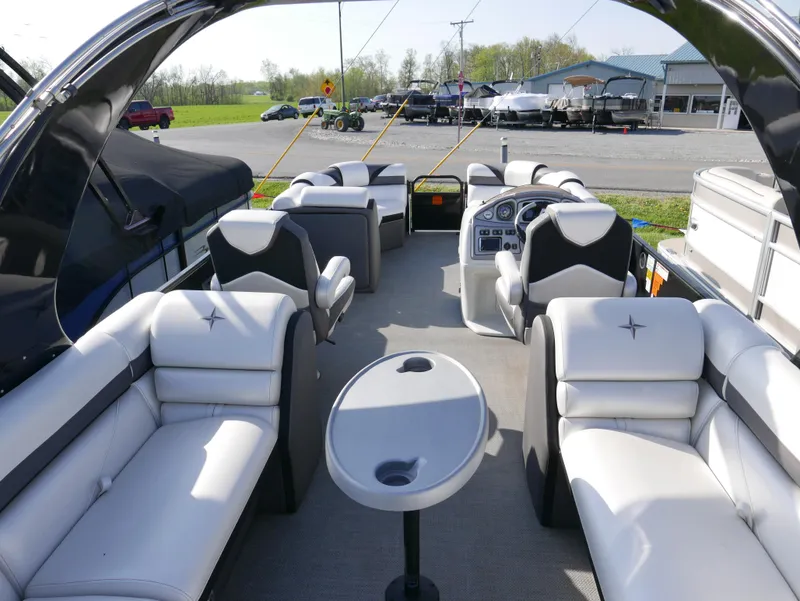 Slide: The Image of 2016 Berkshire 23RFX ARCH pontoon boat interior with plush seating and control console. - 10