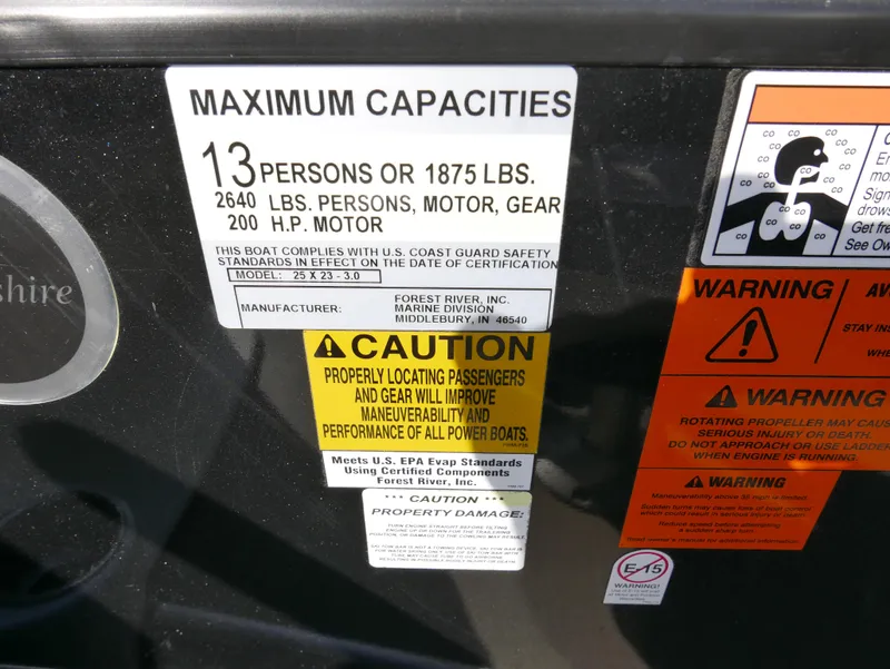 Slide: The Image of 2016 Berkshire 23RFX ARCH boat capacity and safety warning labels. - 11