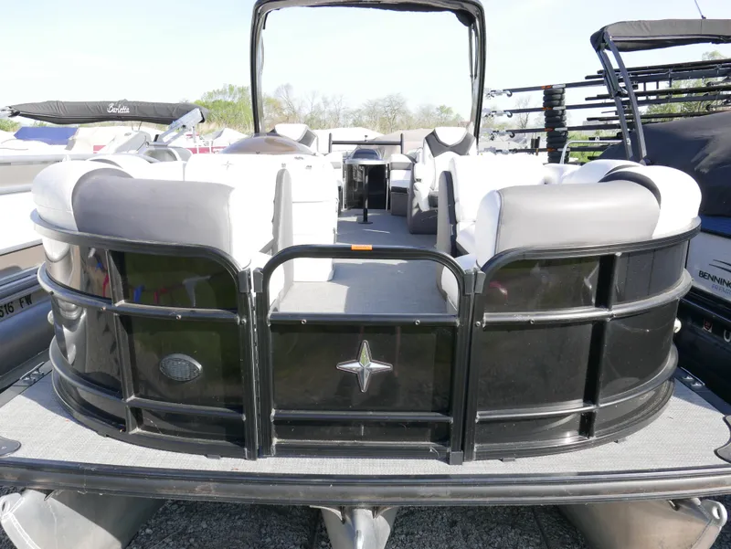 Slide: The Image of 2016 Berkshire 23RFX ARCH pontoon boat with black exterior and spacious seating. - 2