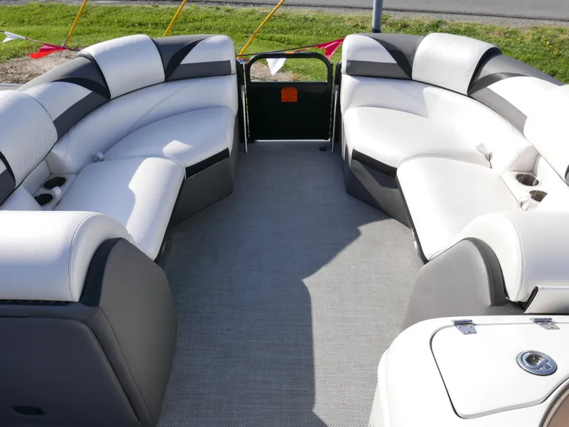Slide: The Image of 2016 Berkshire 23RFX ARCH boat interior with white and gray seating. - 5