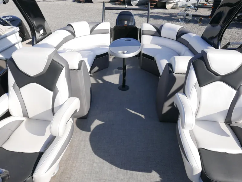 Slide: The Image of 2016 Berkshire 23RFX ARCH boat interior with luxurious seating and table. - 6