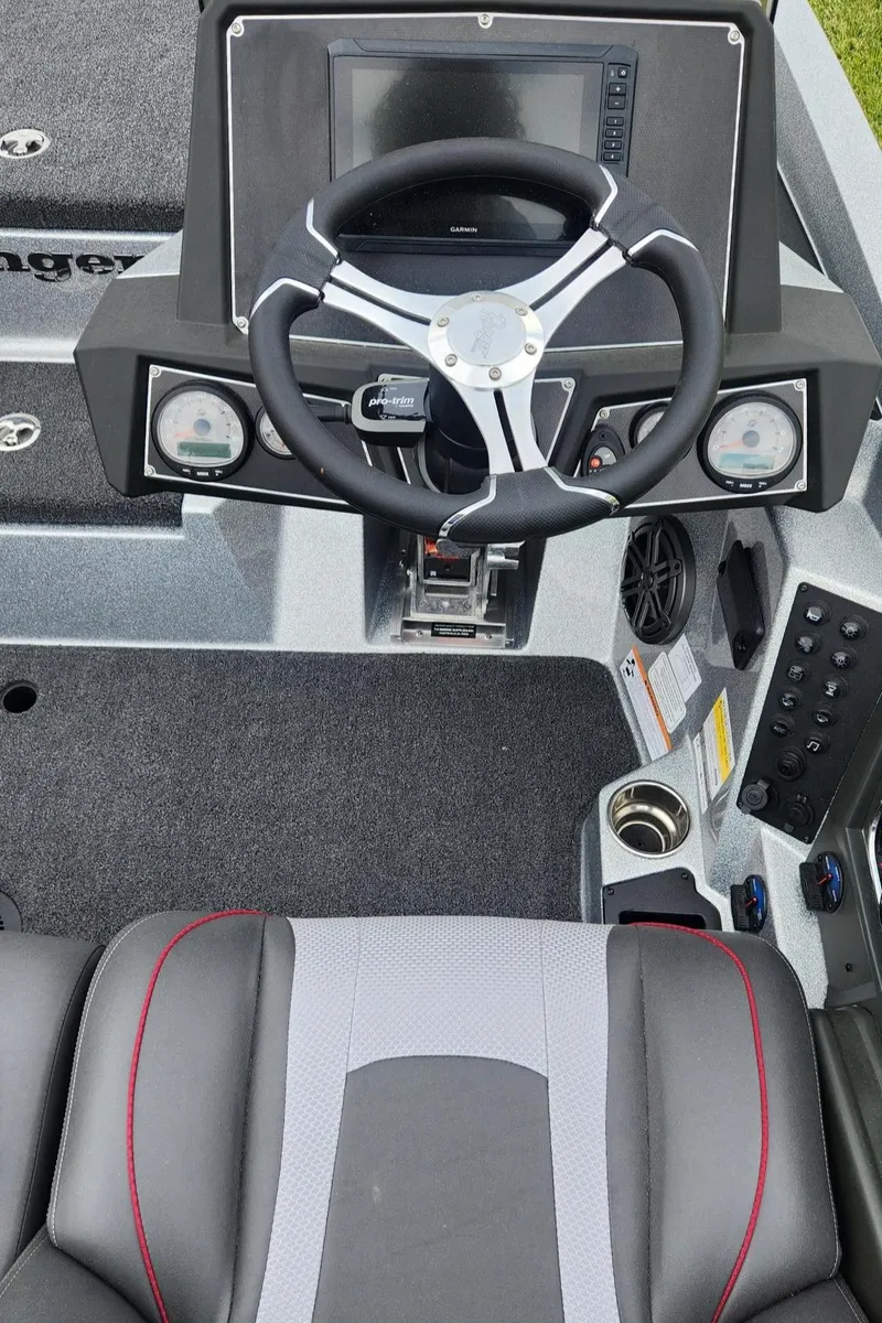 Slide: The Image of 2024 Ranger Z519 Garmin Ranger Cup Equipped boat dashboard and steering wheel. - 5