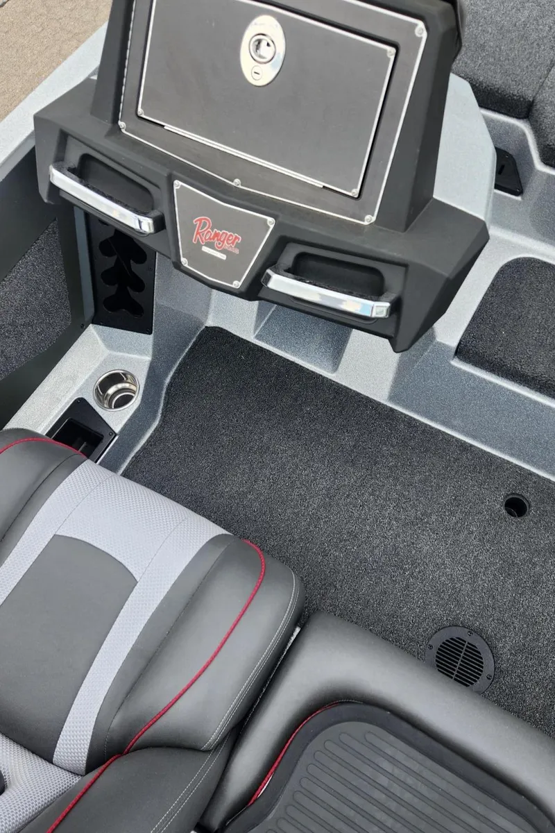 Slide: The Image of 2024 Ranger Z519 Garmin Ranger Cup Equipped boat interior with seating and storage. - 6