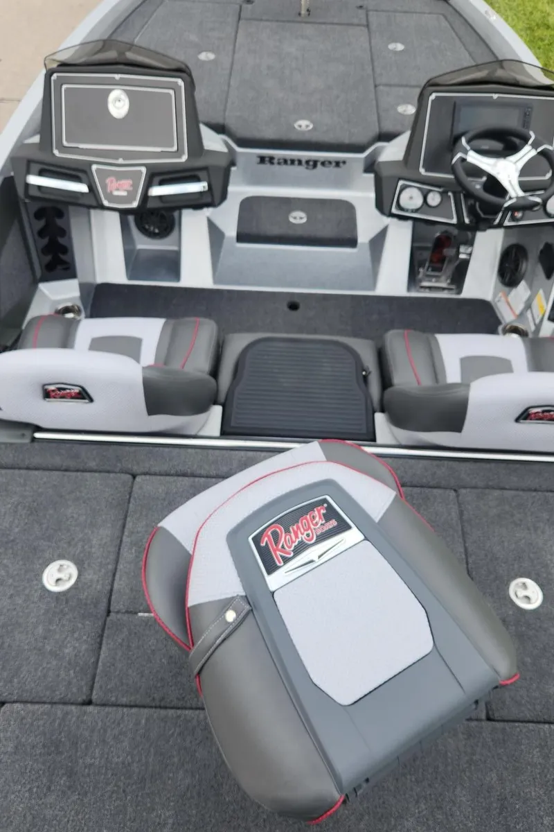 Slide: The Image of 2024 Ranger Z519 Garmin Ranger Cup Equipped boat interior with dual consoles and seating. - 7