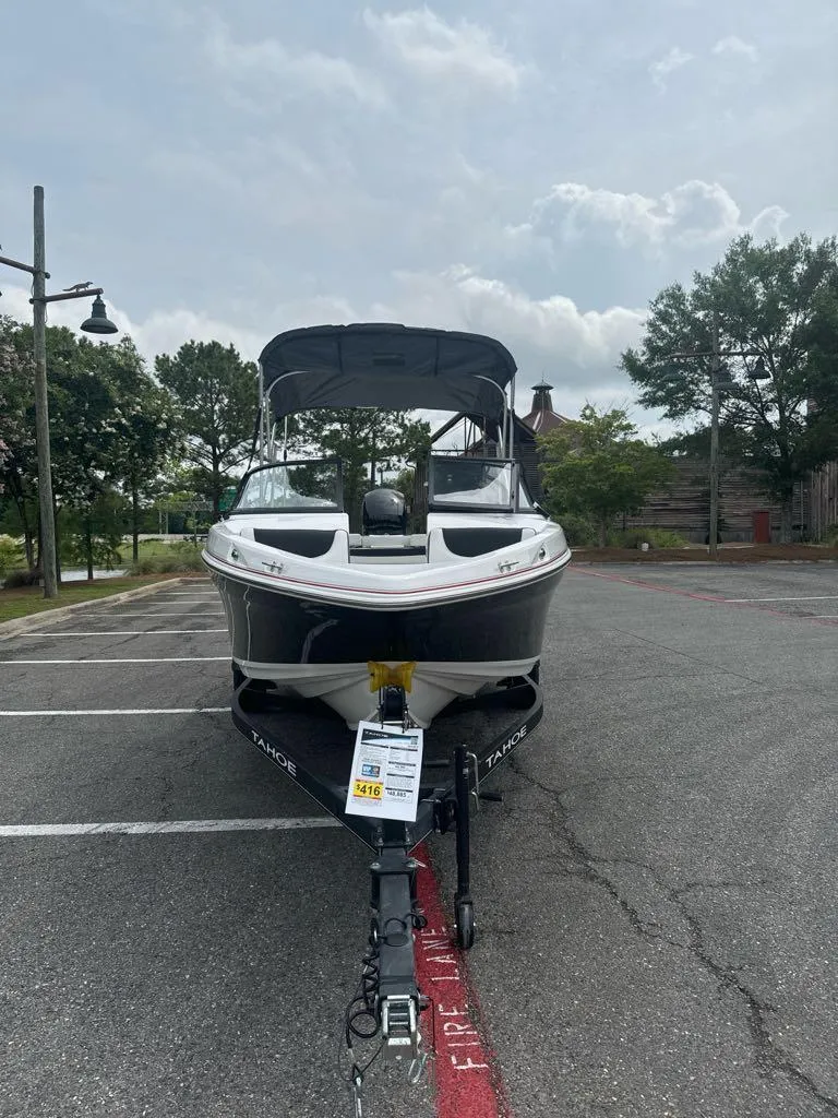 Slide: The Image of 2024 Tahoe 200 S boat parked in an outdoor lot. - 3