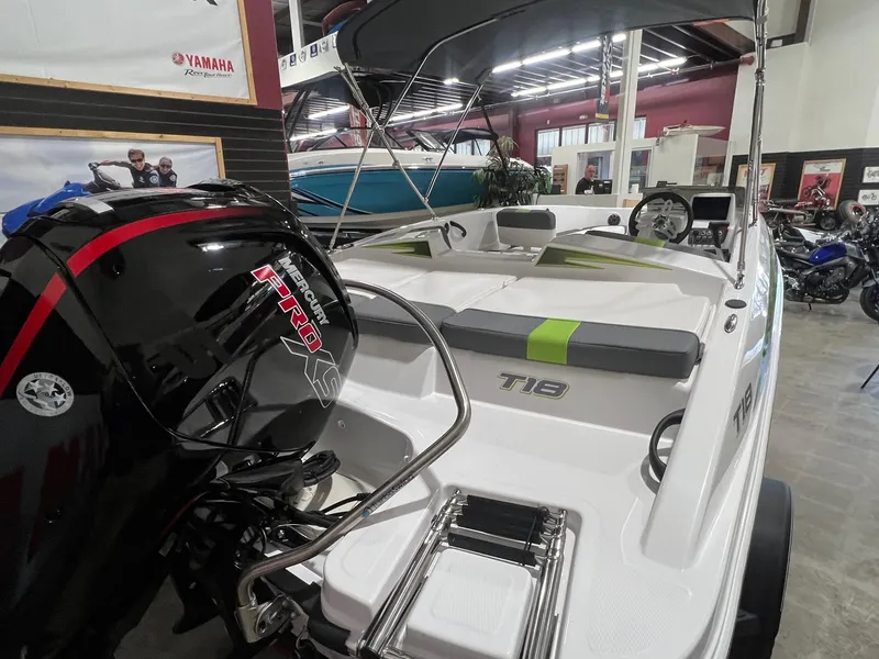 Slide: The Image of 2024 Tahoe T18 boat with Nitro outboard motor in showroom. - 3