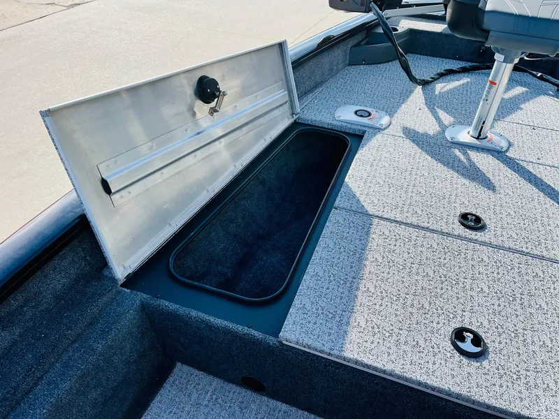 Slide: The Image of Open storage compartment on 2024 Tracker Pro Team 175 TF fishing boat. - 11