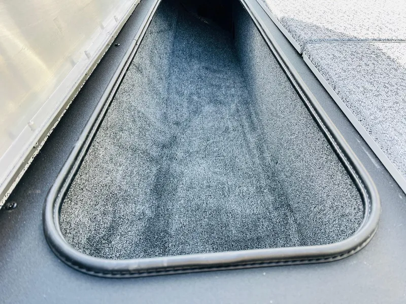 Slide: The Image of 2024 Tracker Pro Team 175 TF boat storage compartment. - 12