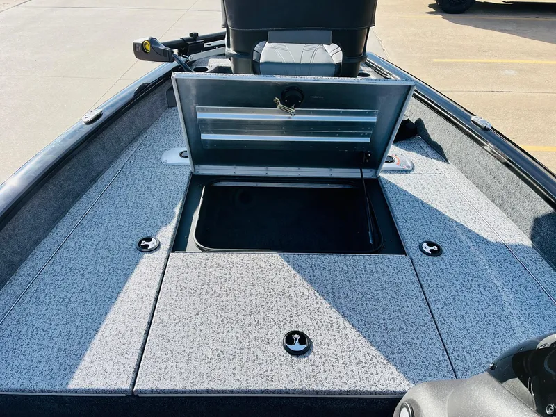 Slide: The Image of 2024 Tracker Pro Team 175 TF boat with open storage compartment. - 13