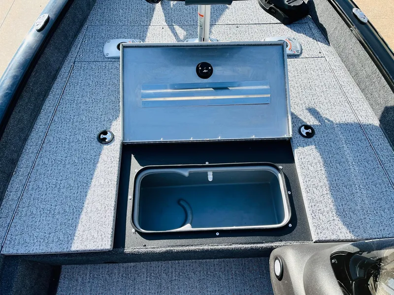 Slide: The Image of 2024 Tracker Pro Team 175 TF boat with open storage compartment. - 14