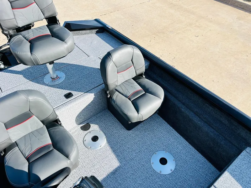 Slide: The Image of 2024 Tracker Pro Team 175 TF boat interior with gray seating. - 18
