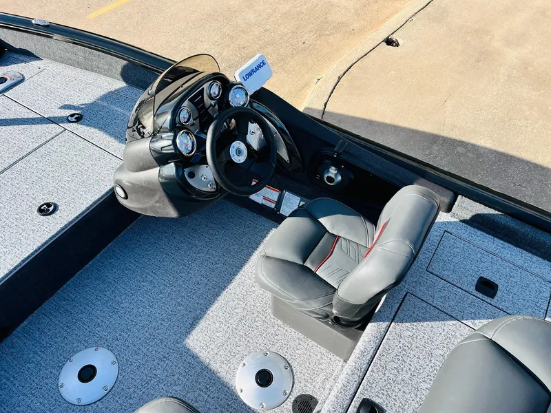 Slide: The Image of 2024 Tracker Pro Team 175 TF boat cockpit with steering wheel and seating. - 19