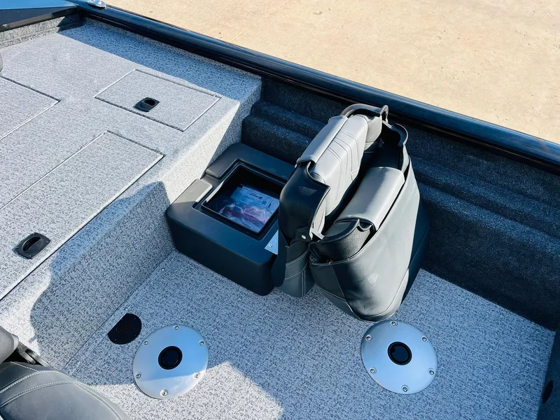 Slide: The Image of 2024 Tracker Pro Team 175 TF boat interior with seating and storage compartments. - 24