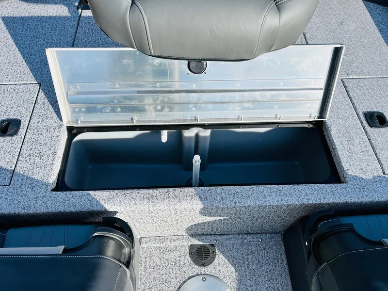 Slide: The Image of 2024 Tracker Pro Team 175 TF boat storage compartment with open lid. - 25