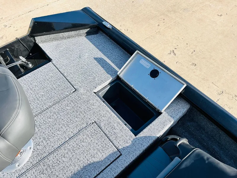 Slide: The Image of 2024 Tracker Pro Team 175 TF boat deck with storage compartment. - 27