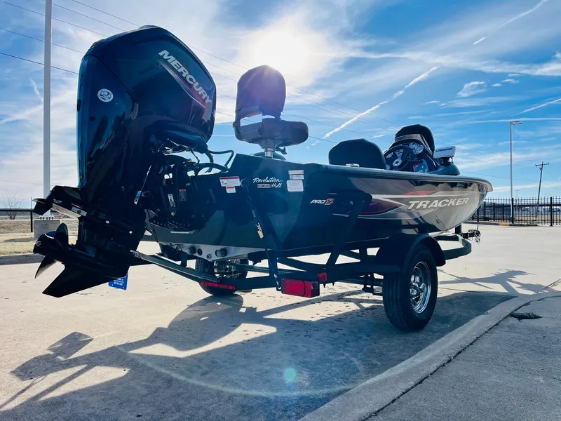 Slide: The Image of 2024 Tracker Pro Team 175 TF fishing boat on trailer, rear view with Mercury outboard motor. - 5