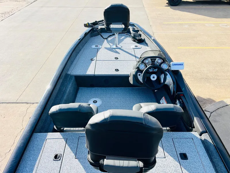Slide: The Image of 2024 Tracker Pro Team 175 TF fishing boat interior with steering console and seating. - 8