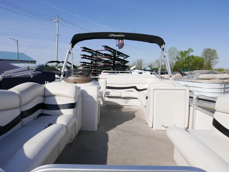 Slide: The Image of 2008 Manitou Oasis pontoon boat with spacious seating and canopy. - 4