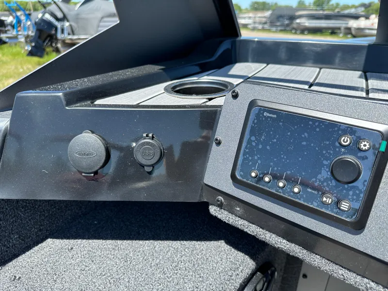 Slide: The Image of 2024 Vexus ADX180 boat dashboard with control panel and USB ports. - 15