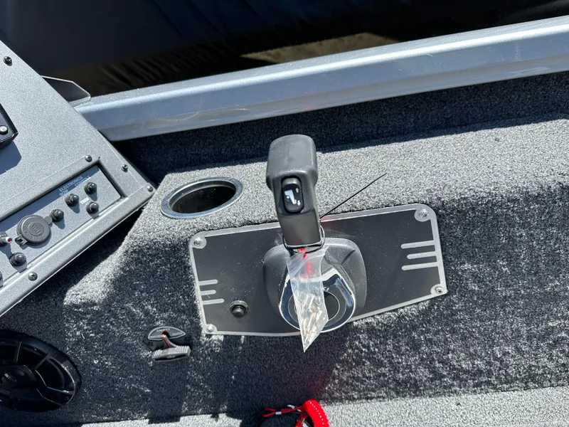 Slide: The Image of 2024 Vexus ADX180 boat control panel with throttle lever and cup holder. - 19