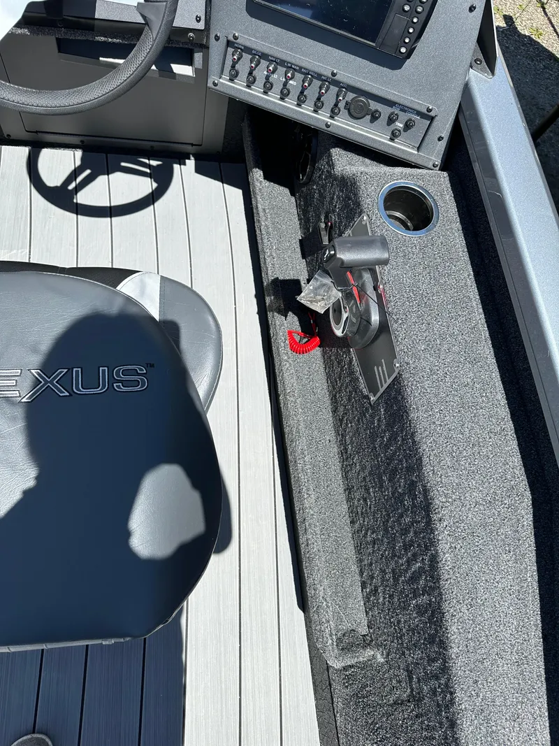 Slide: The Image of 2024 Vexus ADX180 boat interior with control panel and seating. - 3