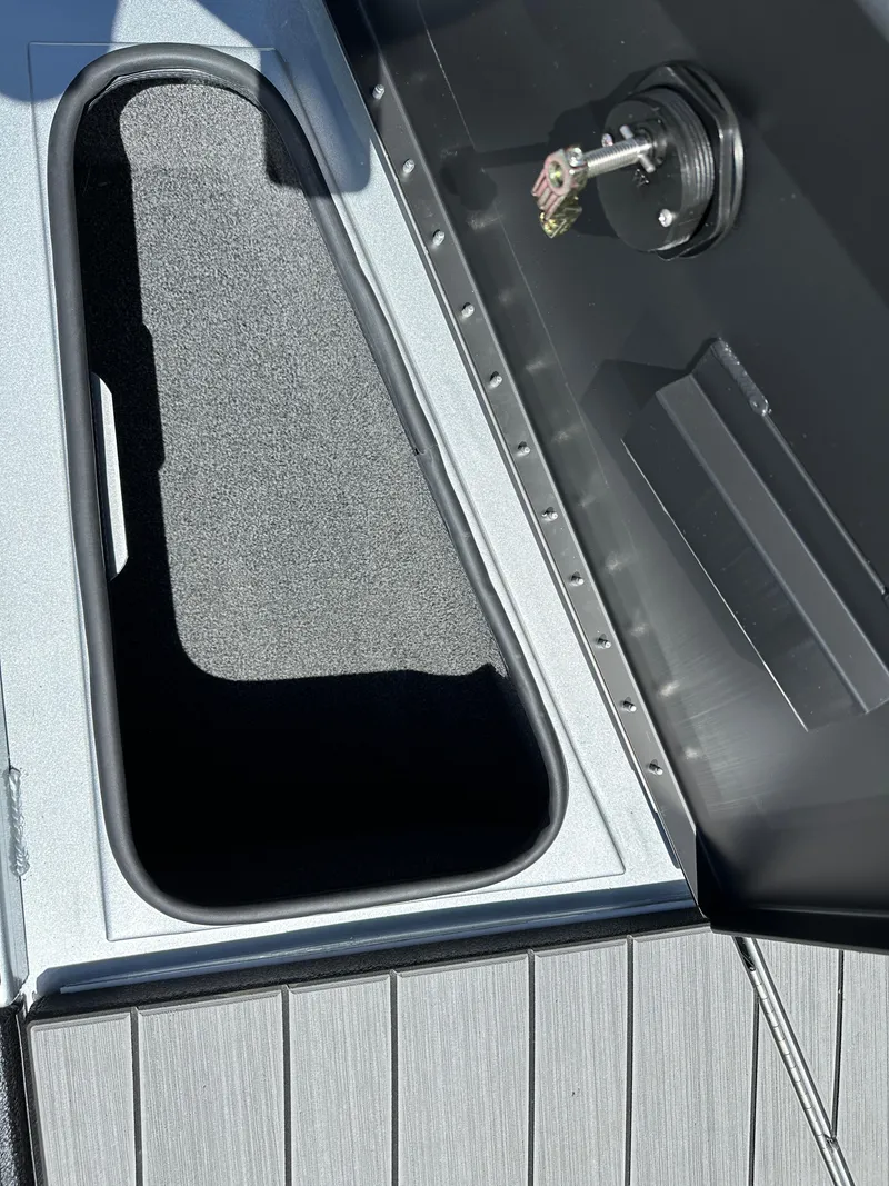 Slide: The Image of 2024 Vexus ADX180 boat storage compartment and key ignition. - 9