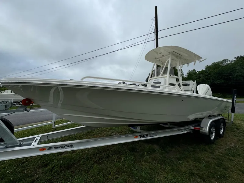Slide: The Image of 2024 Pathfinder 2600 TRS boat on AmeraTrail trailer, side view. - 2
