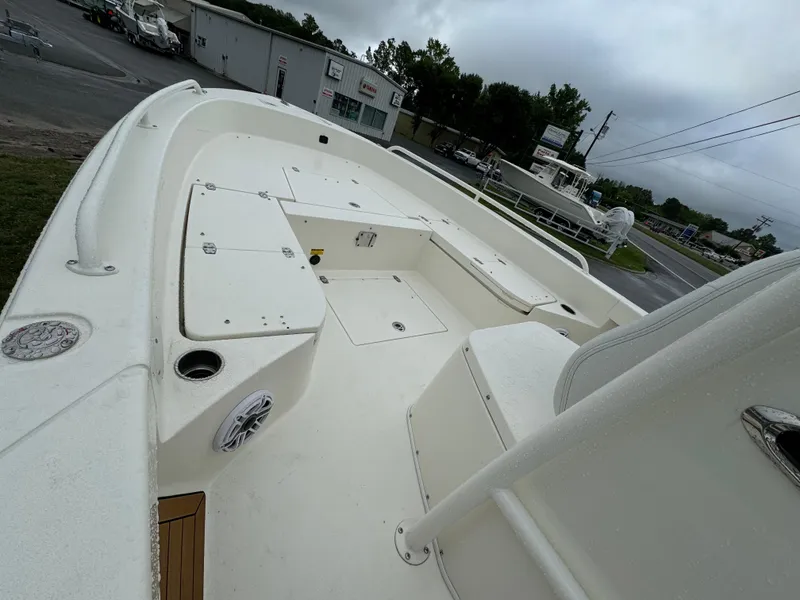 Slide: The Image of 2024 Pathfinder 2600 TRS boat interior with storage compartments and seating. - 8