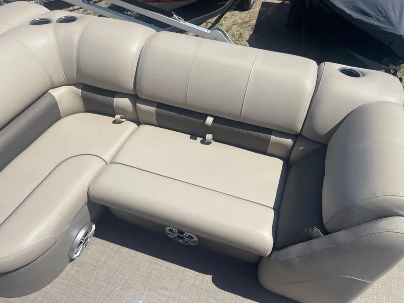 Slide: The Image of 2023 Sun Tracker SportFish 22 XP3 boat seating area with beige upholstery. - 11