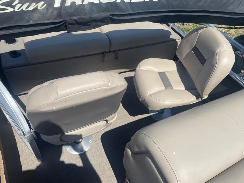 Slide: The Image of 2023 Sun Tracker SportFish 22 XP3 boat interior with beige seating. - 14