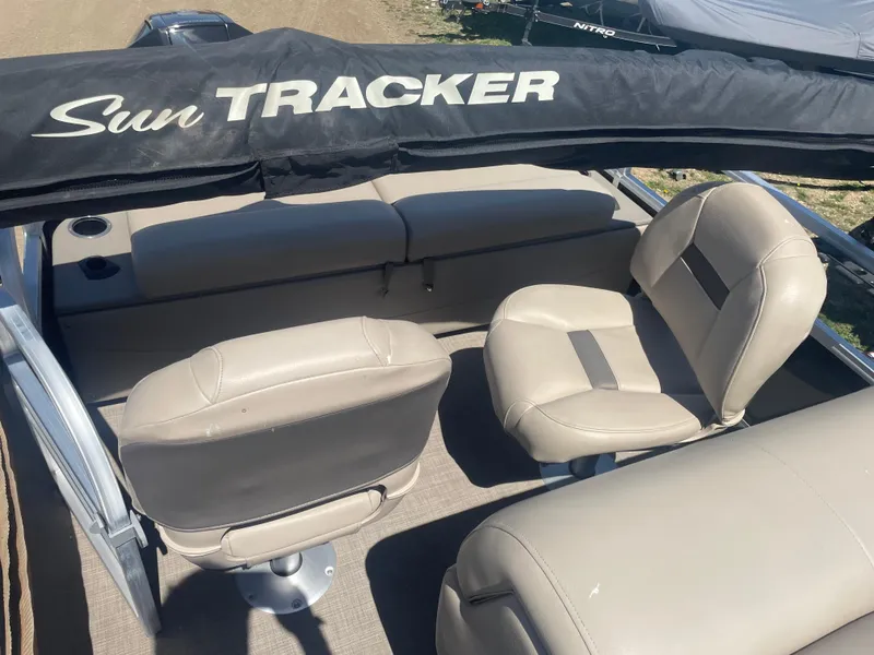 Slide: The Image of 2023 Sun Tracker SportFish 22 XP3 boat interior with beige seating. - 15