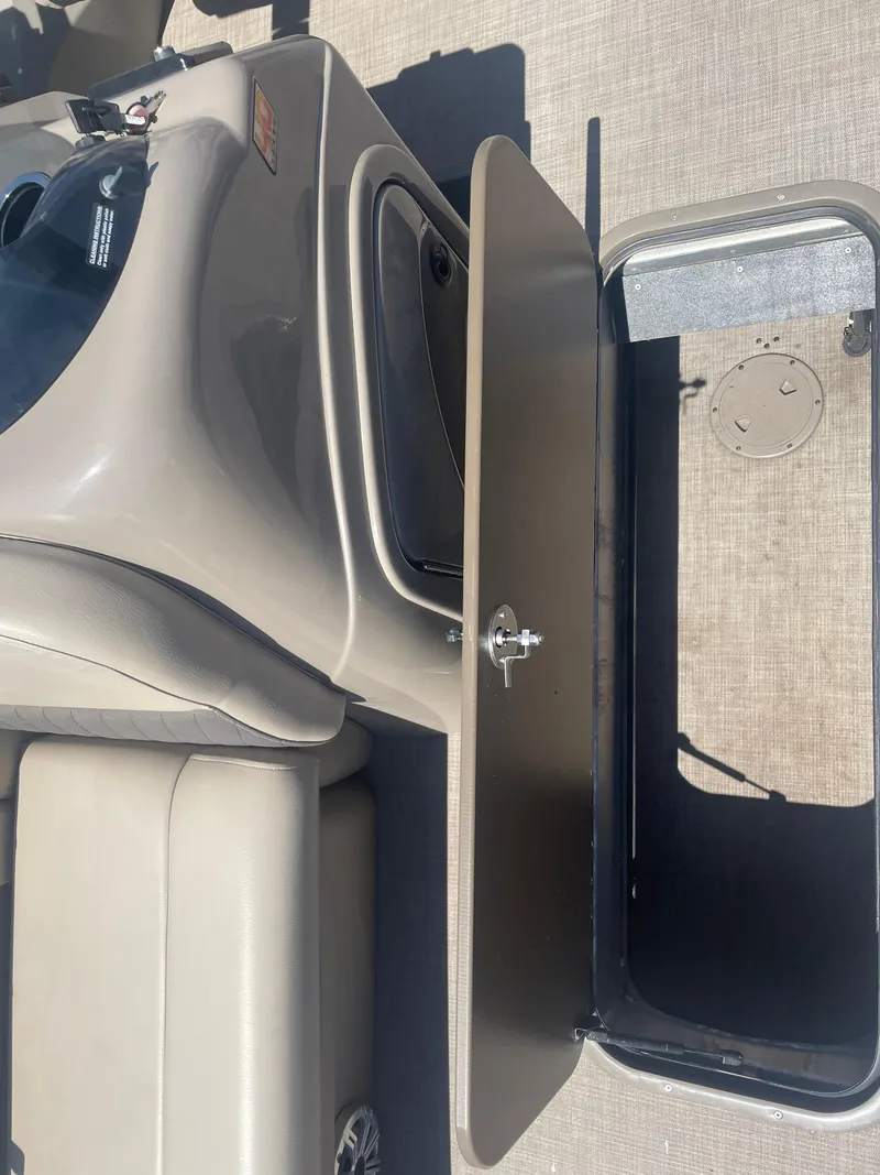 Slide: The Image of 2023 Sun Tracker SportFish 22 XP3 boat interior storage compartment. - 18